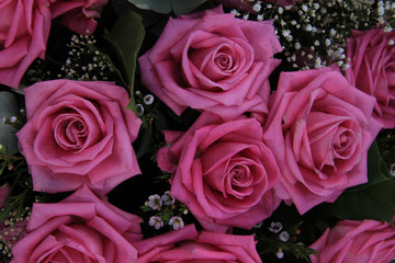 Big pink roses in a bridal bouquet