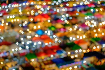 Fototapeta na wymiar Thai night market / Blur of famous night market at twilight. Ratchada Train Market : second hand night market, Bangkok, Thailand.