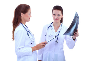 Two woman nurse watching X Ray image, standing in hospital