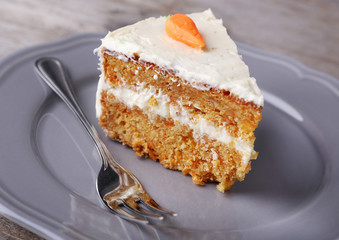 Piece of carrot cake on plate, closeup