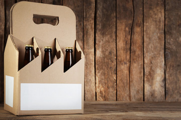 Paper beer package  on wooden background