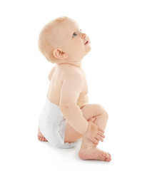 Baby sitting on white background
