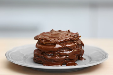 Chocolate pancakes on table