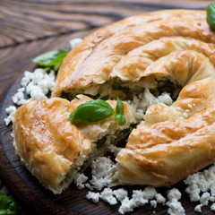 Close-up of burek with cheese and spinach, selective focus