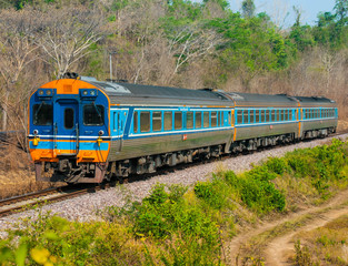 Obraz premium Diesel railcar set was passing through hill side field, 2016.