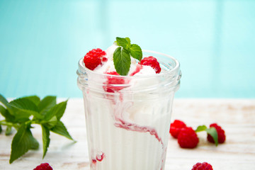 Ice cream with berries on wooden background