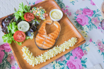 Grilled Salmon steak with salad.