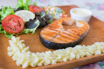 Grilled Salmon steak with salad.