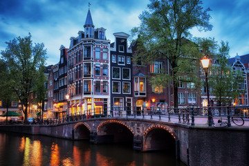 Naklejka premium City of Amsterdam at twilight in Holland, Netherlands