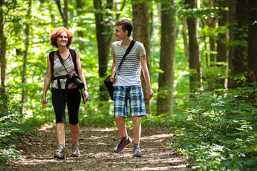 Obraz premium Family hiking in the forest