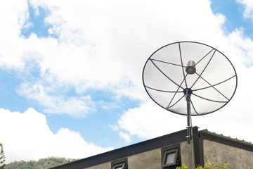 television Satellite dish antenna on top of the house building