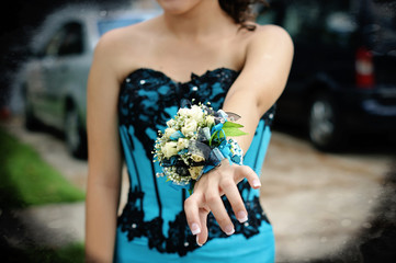 Pretty turquoise and black wrist corsage worn to the prom.