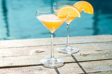 cocktail on the pool nosing at the tropical resort