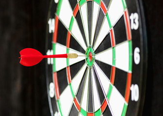 Red Dart in Bulls Eye Center of Board