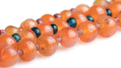 old carnelian beads isolated on white background
