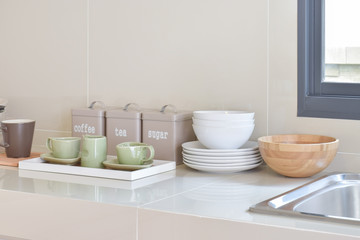 Fototapeta na wymiar modern pantry with white utensil in kitchen