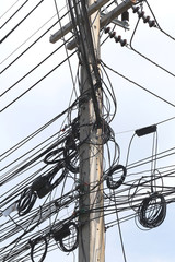Messy cable electricity post.