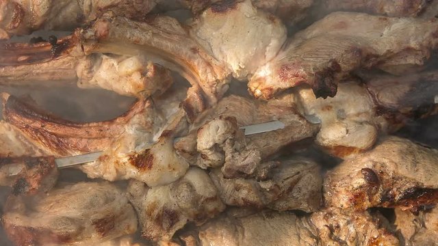 Food. Preparation of roasted meat on the fire outdoors for a picnic and relax.