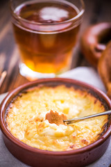worming cheese fondue with pretzel at winter