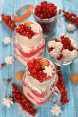 Dessert with red currant and whipped cream