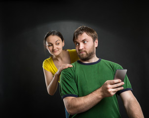 Couple playing with smartphone