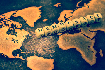 DEMOCRACY on grunge world map