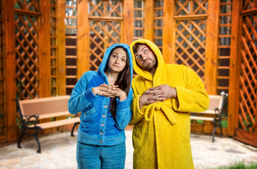 Pensive couple wearing pijamas