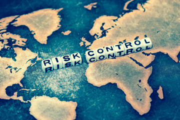 RISK CONTROL on grunge world map