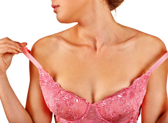 Unrecognizable girl removes underwear to examine their breasts. Female breast self exam.