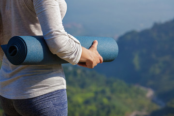 Woman standing with yoga 