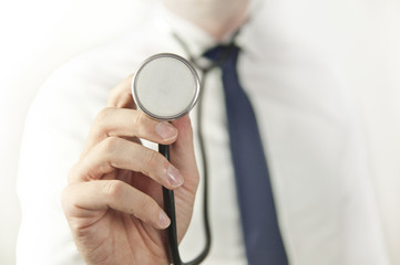 Medicine doctor wearing tie with stethoscope on white