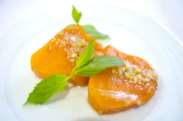 Turkish traditional pumpkin dessert. Pumpkin, walnuts, sugar, mint.
