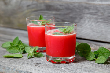watermelon juice with mint on wooden background