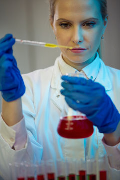 Female researcher carrying out research experiments.