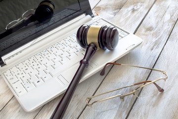 Obraz na płótnie Canvas Law concept. Close up of judge gavel and laptop