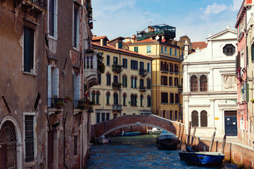Obraz na płótnie Canvas Exteriors of old Venice houses, buildings on water. Italy