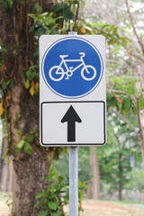 Street signs in road for bicycle.