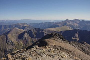Fototapeta na wymiar Panorama of the Pyrenees mountains in Andorra, from top of Coma Pedrosa peak.