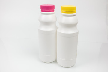 Two Glass bottle of milk with isolated on a white background.