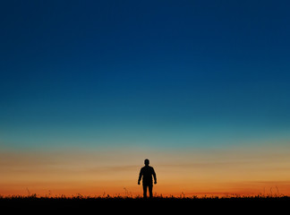 Silhouette of man at sunset the sun.