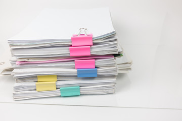 Pile of documents on white background.