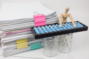Pile of documents have abacus on white background.