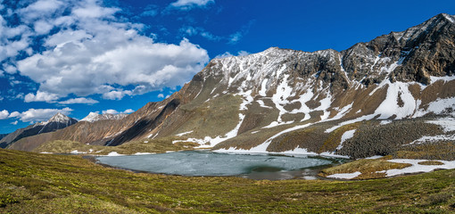 Frozen mountain lake under the pass Shumaksky in Tunka range