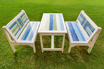 Tropical wooden table on the grass