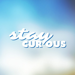 Fototapeta na wymiar Stay Curious - Inspirational Quote, Slogan, Saying - Concept Illustration with Label on Shimmering Light Blue Blurry Background
