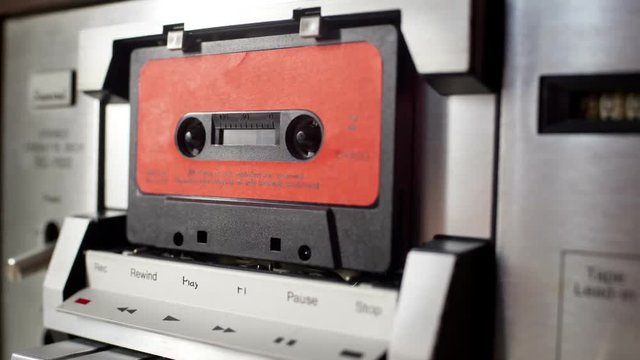 audio cassettes in a retro tape player
