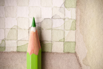 Sharp light green pencil tip shot as closeup image on checkers tiling floor as watercolor floor plan illustration