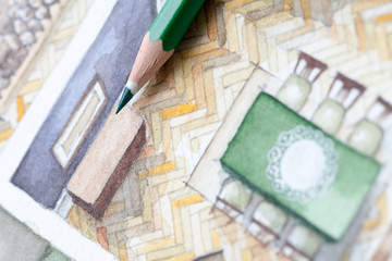 Sharp green glazed wooden pencil tip shot on living room watercolor floor plan showing artistic trends in the interior design process