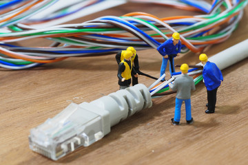 Group of engineer workers are repair LAN network connection Ethe