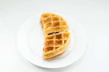 Waffle on white dish on white background